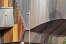 Modern building with curved and angular wooden and metal exterior at Burrinja Cultural Centre.