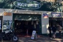 The Motorist Museum building with motorcycles parked outside and people visiting.