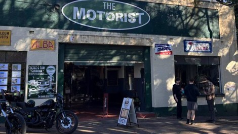 The Motorist Museum building with motorcycles parked outside and people visiting.